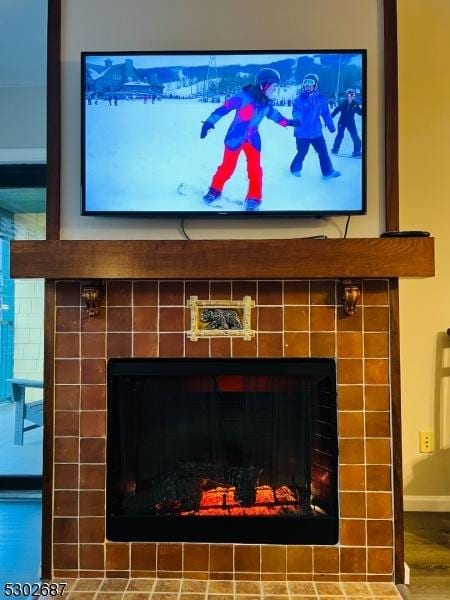 details with a tiled fireplace