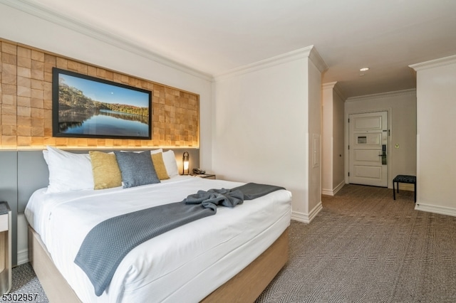 bedroom with crown molding and carpet flooring