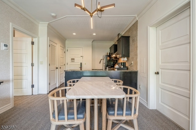 carpeted dining area with crown molding and a chandelier