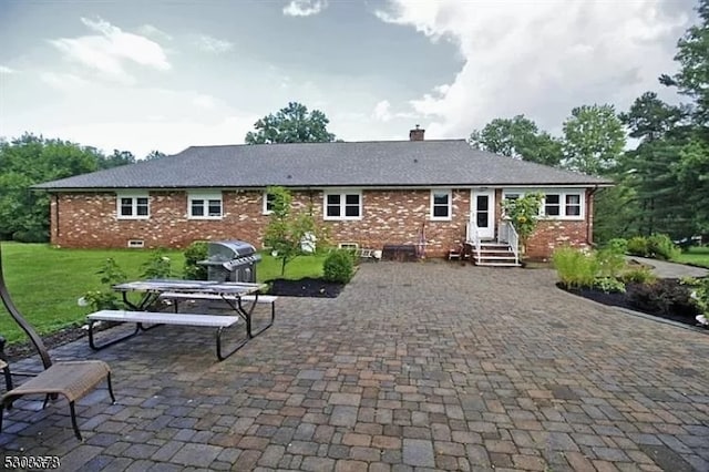 rear view of property featuring a patio