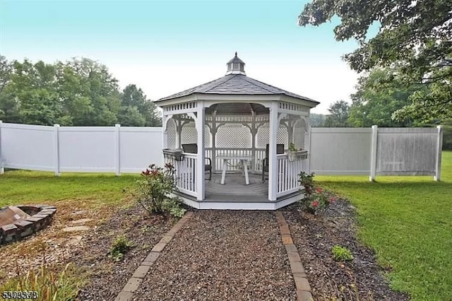 view of outdoor structure with a lawn and a gazebo