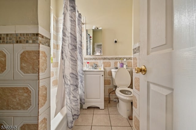 full bathroom featuring tile patterned flooring, toilet, vanity, tile walls, and decorative backsplash