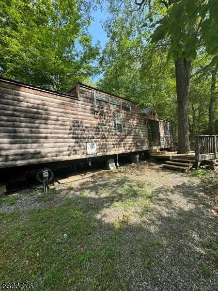 view of yard featuring a wooden deck