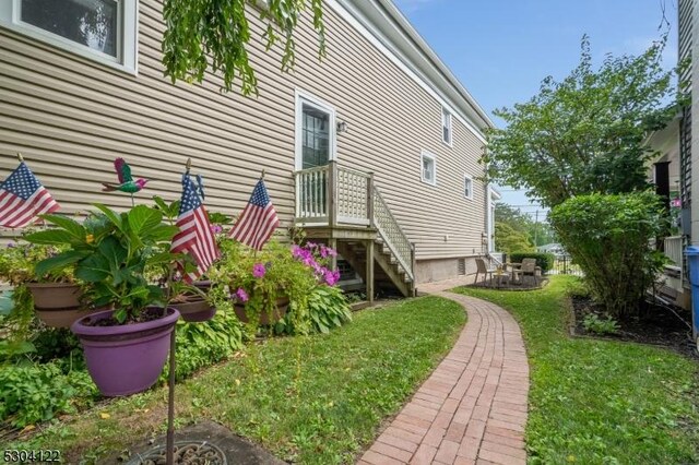 view of home's exterior with a yard