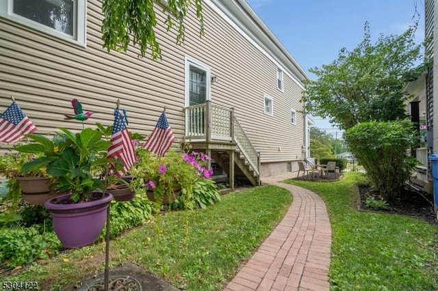 view of home's exterior featuring a yard