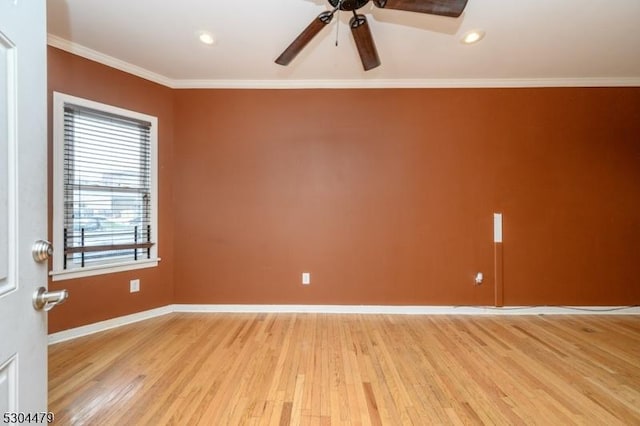 spare room with crown molding, light hardwood / wood-style flooring, and ceiling fan