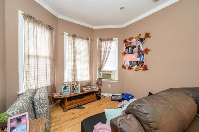 interior space with cooling unit, wood-type flooring, and crown molding