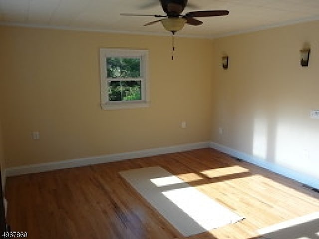 unfurnished room featuring crown molding, ceiling fan, and hardwood / wood-style floors