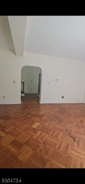 additional living space with parquet flooring