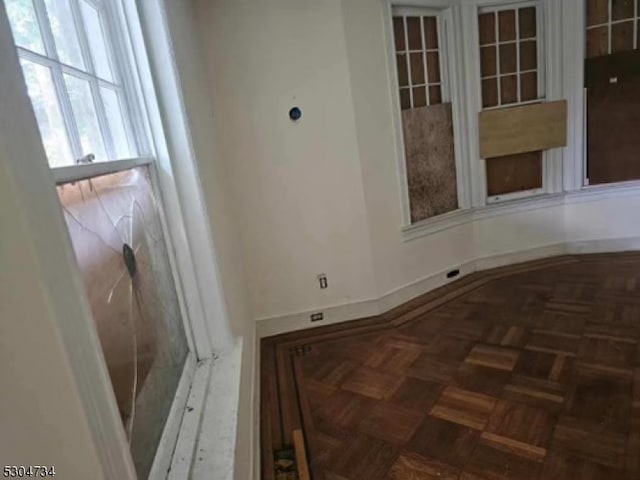 interior space with dark parquet floors