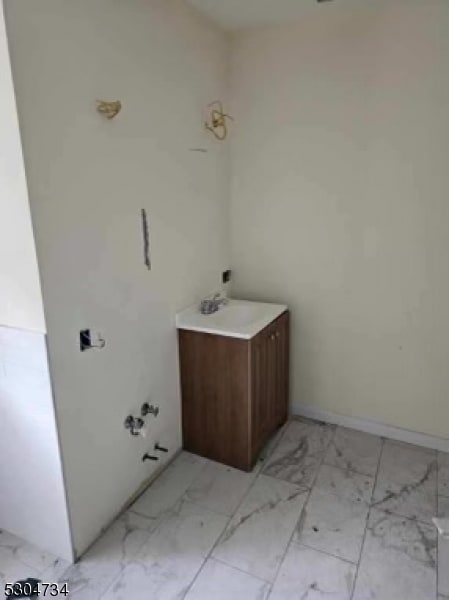 bathroom featuring tile patterned flooring and vanity