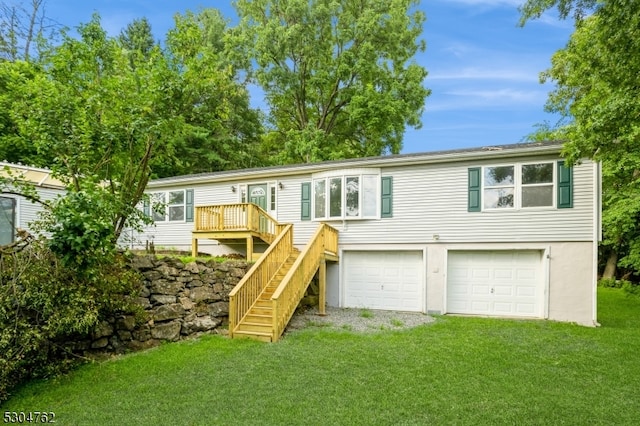 view of front of house with a garage and a front yard