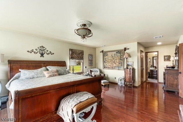 bedroom with dark wood-type flooring