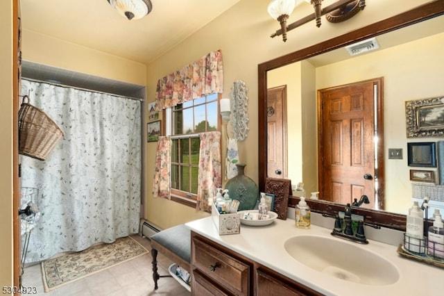 bathroom with a baseboard radiator, a shower with shower curtain, and vanity