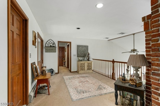 interior space featuring light carpet and ceiling fan