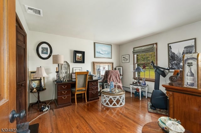 office space with hardwood / wood-style flooring