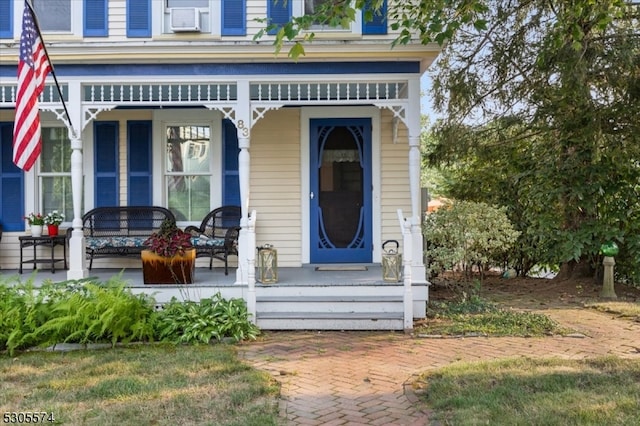 entrance to property featuring covered porch