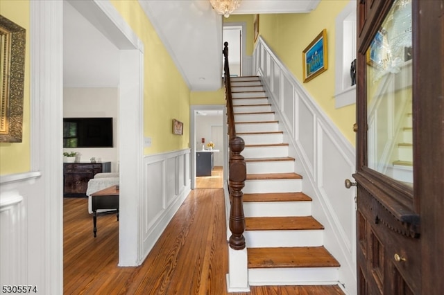 stairway with hardwood / wood-style floors