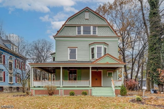 victorian-style house featuring covered porch