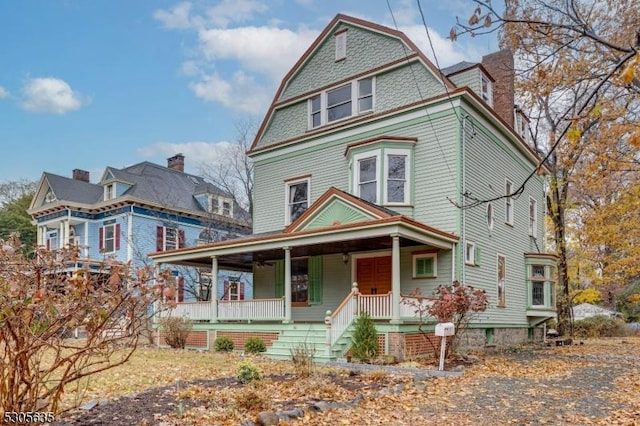 victorian house featuring covered porch