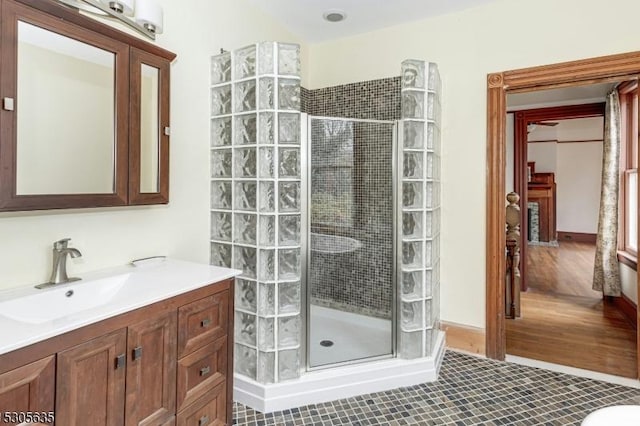 bathroom with vanity, tile patterned floors, and walk in shower