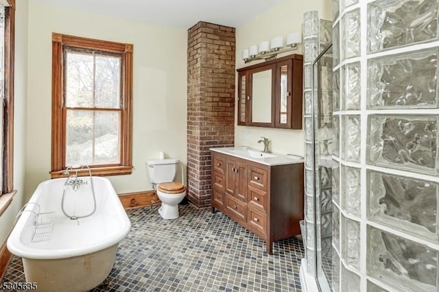 full bathroom with tile patterned flooring, vanity, toilet, and separate shower and tub