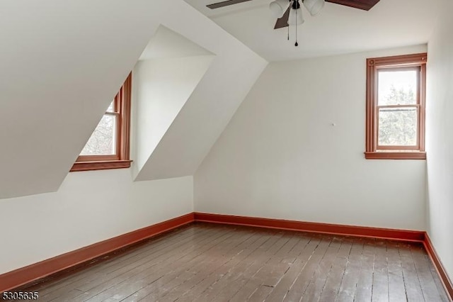 bonus room featuring hardwood / wood-style flooring, ceiling fan, and vaulted ceiling