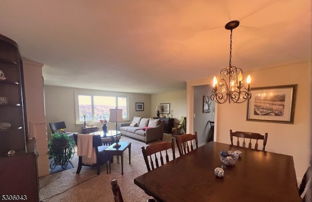 carpeted dining room featuring an inviting chandelier