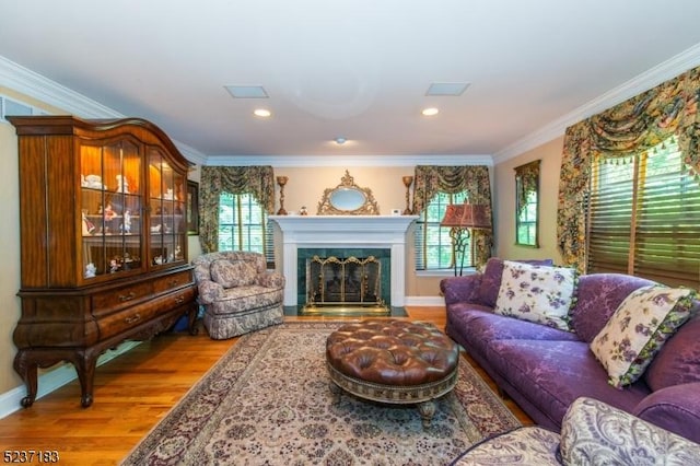 living room with crown molding and hardwood / wood-style flooring