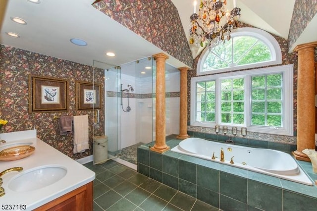 bathroom with ornate columns, vanity, separate shower and tub, and a wealth of natural light