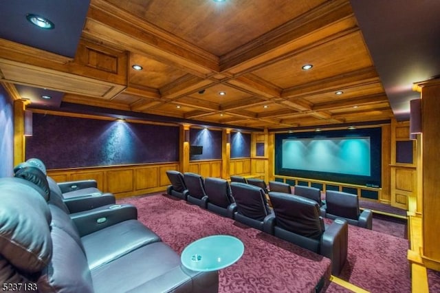 carpeted home theater room with wood ceiling, ornamental molding, coffered ceiling, and beamed ceiling