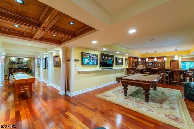 game room with billiards, bar, decorative columns, coffered ceiling, and wood-type flooring