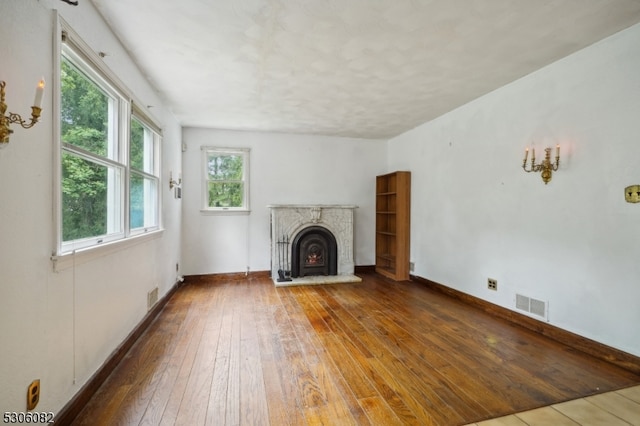 unfurnished living room featuring wood-type flooring