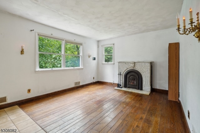 unfurnished living room featuring wood-type flooring