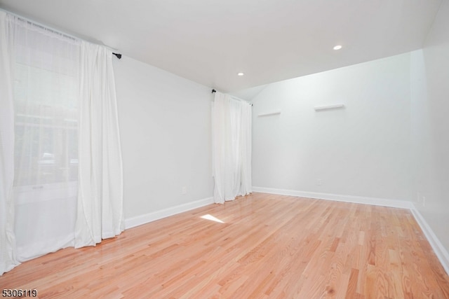 spare room with light hardwood / wood-style floors