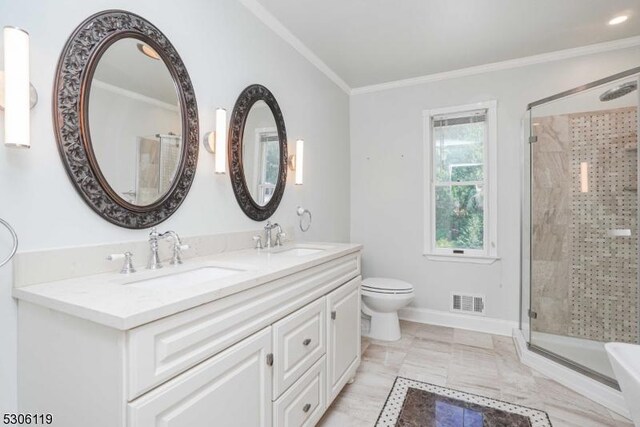 bathroom featuring crown molding, toilet, tile patterned flooring, dual vanity, and a shower with shower door