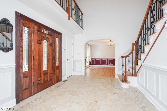 foyer featuring a wealth of natural light and light hardwood / wood-style floors