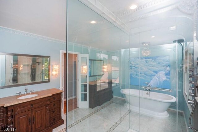 bathroom featuring vanity, a bath, and tile patterned flooring