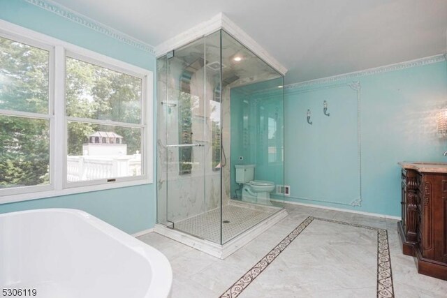 full bathroom featuring vanity, toilet, tile patterned flooring, and separate shower and tub