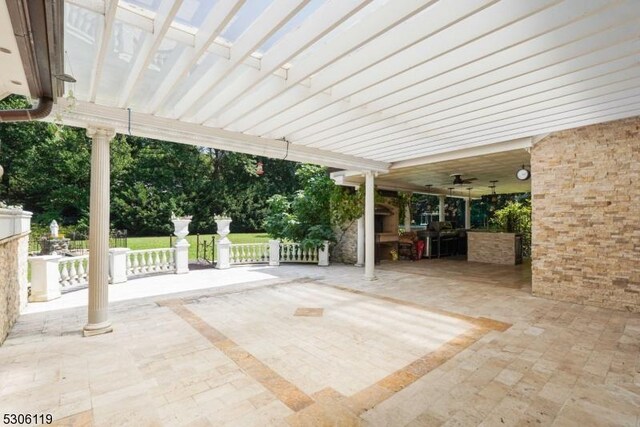 view of patio / terrace featuring ceiling fan, a pergola, and area for grilling