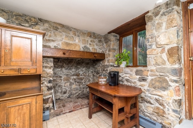 interior space with a baseboard radiator