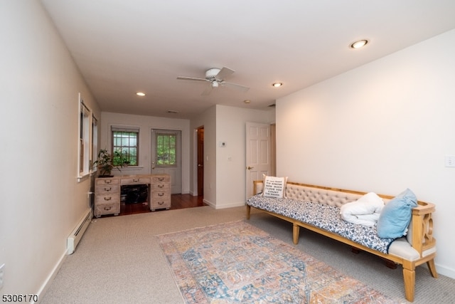 interior space with ceiling fan and a baseboard radiator