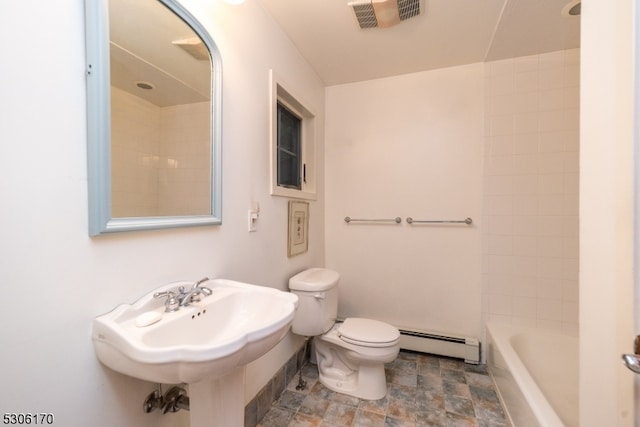 bathroom featuring toilet, a baseboard heating unit, shower / bath combination, and tile patterned floors