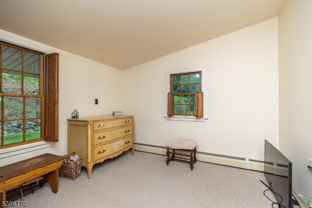 living area featuring light colored carpet and vaulted ceiling