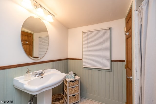 bathroom with tile patterned flooring