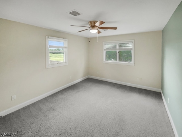 carpeted empty room with ceiling fan