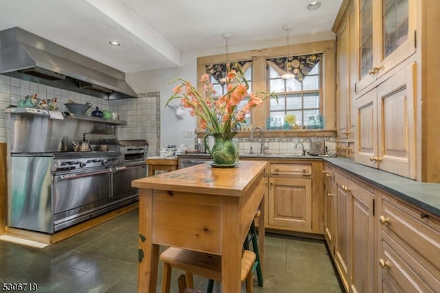 kitchen with sink, wooden counters, backsplash, and dark tile patterned floors