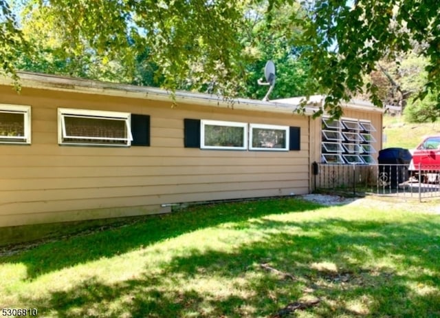 view of home's exterior featuring a yard