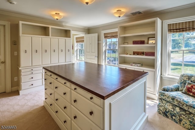 walk in closet featuring light colored carpet