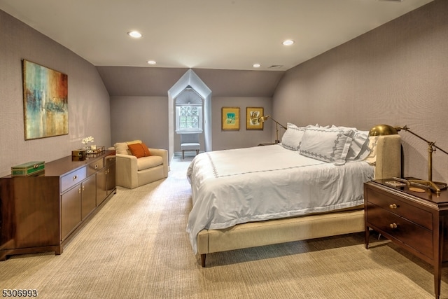 carpeted bedroom with vaulted ceiling